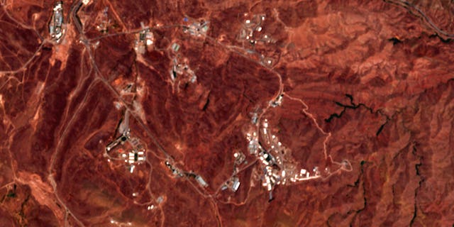 This June 21, 2020 photo from the European Commission's Sentinel-2 satellite shows a site before an explosion June 26, 2020, that rattled Iran’s capital. Analysts say the blast came from an area in Tehran’s eastern mountains they hides a underground tunnel system and missile production sites. (European Commission via AP)