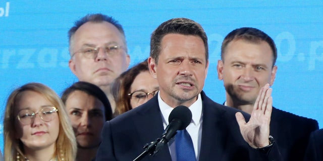 Warsaw Mayor Rafal Trzaskowski, front, reacting to the exit poll Sunday.