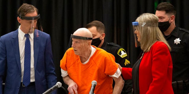 Joseph James DeAngelo, center, charged with being the Golden State Killer, is helped up by his attorney, Diane Howard, at Sacramento Superior Court in California on June 29, 2020.