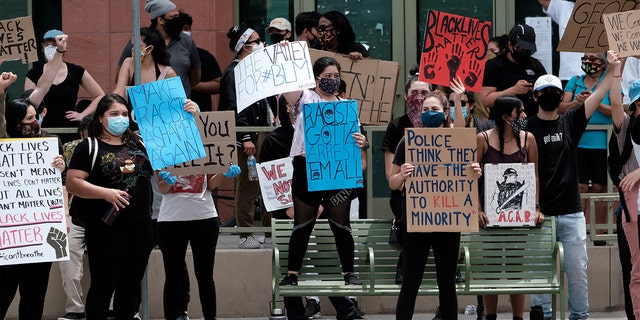 Peaceful Protesters With Anti Police Signs Cast Doubts Over Unifying Message Fox News 