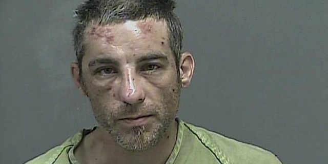 Alex Jessee, 36, was arrested Saturday after allegedly biting off the top of a police officer's pinkie finger in Tennessee, authorities say. (Kingsport Police Department)