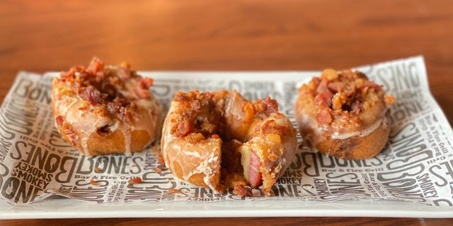 Their "doughnut" features a 3/8th-inch (thick) slice of Applewood smoked bacon, hand-carved and then candied in brown sugar and black pepper.