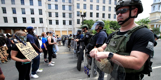 Demonstrators protest the death of George Floyd, Wednesday, June 3, 2020, near the White House in Washington. Floyd died after being restrained by Minneapolis police officers. (AP Photo/Manuel Balce Ceneta)