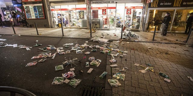 Goods lie on the floor after people broke into a shop on Marienstrasse in Stuttgart, Germany, Sunday, June 21, 2020. Dozens of violent small groups devastated downtown Stuttgart on Sunday night and injured several police officers, German news agency DPA reported.