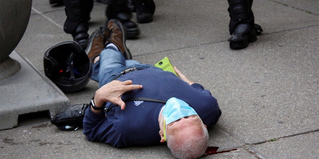 Martin Gugino, a 75-year-old protester, is lying on the ground after being pushed on June 4, 2020 by two police officers from Buffalo, NY.  (Reuters)