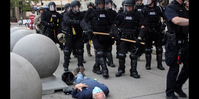 Martin Gugino, a 75-year-old protester, lays on the ground after he was shoved by two Buffalo, New York, police officers during a protest against the death in Minneapolis police custody of George Floyd in Niagara Square in Buffalo, New York, U.S., June 4, 2020. Picture taken June 4, 2020. 