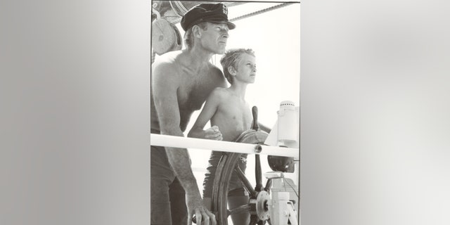 Charlton Heston and Fraser Heston spending time together.