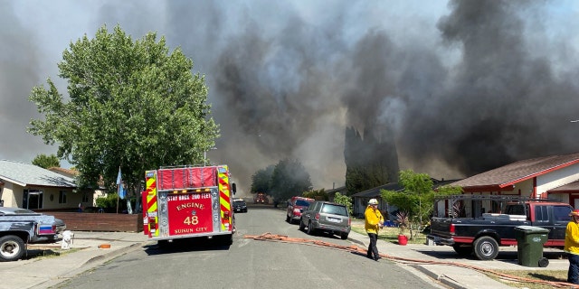 Several homes were destroyed after a wildfire erupted Wednesday in a California neighborhood.
