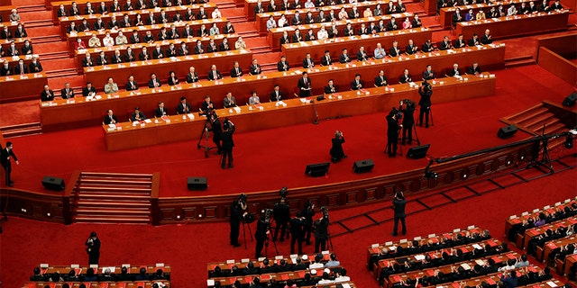 Chinese officials and delegates attend the closing session of the National People's Congress at the Great Hall of the People in Beijing May 28, 2020.