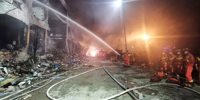In this photo released by Xinhua News Agency, firefighters work at the site of buildings damaged after a tanker truck explosion on a highway in Wenling, in eastern China's Zhejiang Province on Saturday, June 13, 2020.
