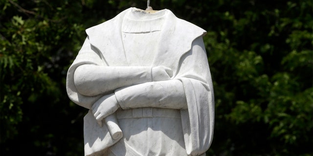 A damaged Christopher Columbus statue stands in a waterfront park near Boston's traditionally Italian North End neighborhood, June 10, 2020. (Associated Press)
