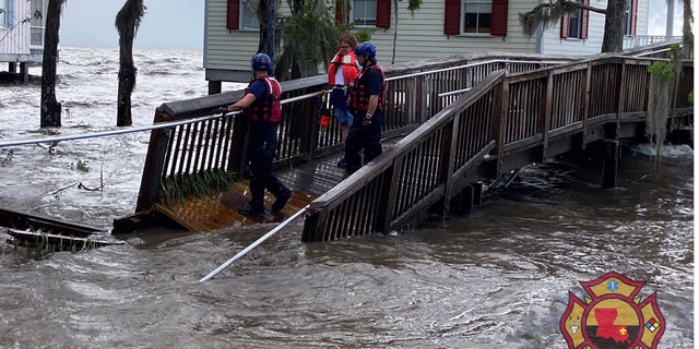 A rescue on Monday in Mandeville, La. after storm surge flooding from Tropical Depression Cristobal.