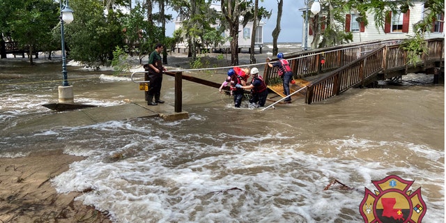 A rescue on Monday in Mandeville, La. after storm surge flooding from Tropical Depression Cristobal.