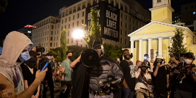 Protesters gather on Black Lives Matter Plaza after they attempted to pull down the statue of Andrew Jackson in Lafayette Square near the White House on June 22, 2020 in Washington, DC. Protests continue around the country over the deaths of African Americans while in police custody. 