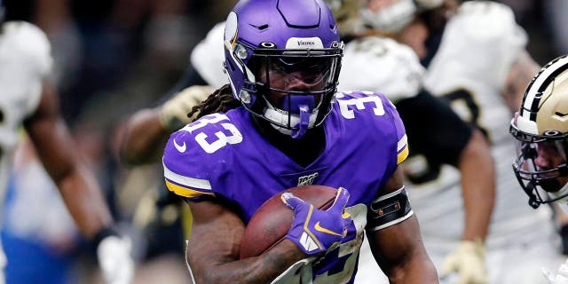 Minnesota Vikings running back Dalvin Cook (33) carries for a touchdown in front of New Orleans Saints free safety Marcus Williams (43) in the first half of an NFL wild-card playoff football game, Sunday, Jan. 5, 2020, in New Orleans. (AP Photo/Brett Duke)