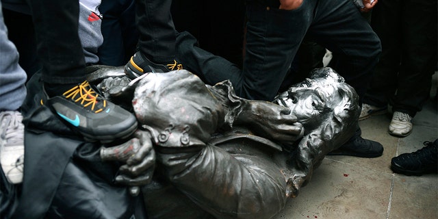 UK crowd tears down statue of 17th-century slave trader Edward ...