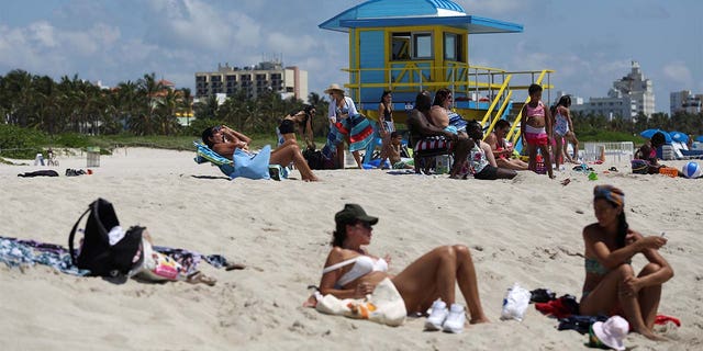 Beachgoers sunbathe as beaches are reopened with restrictions to limit the spread of the coronavirus disease (COVID-19), in Miami Beach, Florida, U.S., June 10, 2020.