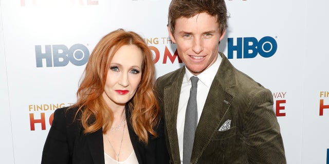 J.K. Rowling, left, and Eddie Redmayne, right, attend the premiere of