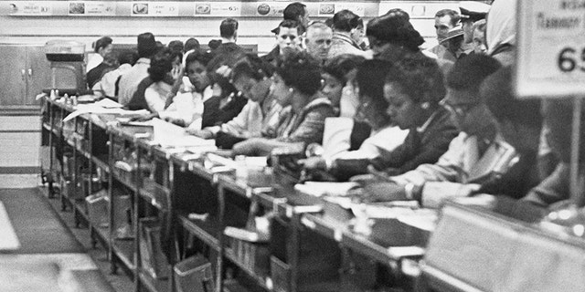 Demonstrations by approximately 400 African-American college students continued in Greensboro as they continued their sit-down strike against local dime stores. This picture shows some of the African-American coeds lining the counter at the F.W. Woolworth Co. (Photo by Bettmann via Getty Images)