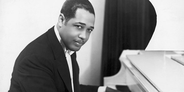 Duke Ellington, American composer and arranger, at the keyboard. Half-length photograph, 1910's.