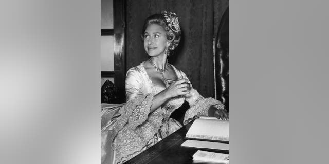 Princess Margaret (1930 - 2002) wearing an eighteenth-century ball gown and a wig to the Georgian Ball, a charity event in aid of the Friends of St. John's at the Mansion House, London, 1st July 1964.