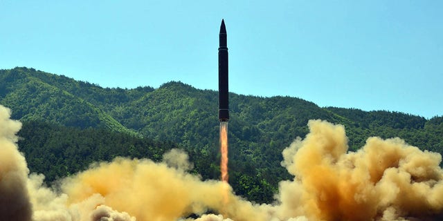 TOPSHOT - This picture taken on July 4, 2017, and released by North Korea's official Korean Central News Agency (KCNA) on July 5, 2017, shows the successful test-fire of the intercontinental ballistic missile Hwasong-14 at an undisclosed location. South Korea and the United States fired off missiles on July 5 simulating a precision strike against North Korea's leadership, in response to a landmark ICBM test described by Kim Jong-Un as a gift to "American bastards".