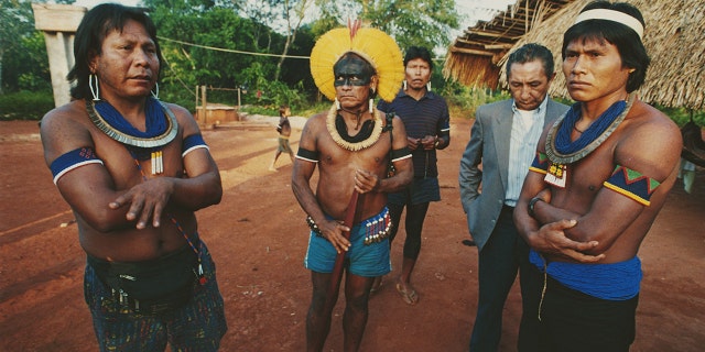 Paulinho Paiakan, left, a leader of the Kayapo people, with his lawyer in the Amazon Basin in Brazil in 1992. (Getty Images)