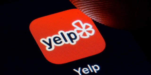 Yelp created a new red icon that will appear on a business' page if its accused of racist behavior. (Photo by Thomas Trutschel/Photothek via Getty Images)