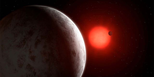The multiplanetary system of newly discovered super-Earths orbiting nearby red dwarf star Gliese 887 is seen in this artist's impression. Mark Garlick/Handout via REUTERS.