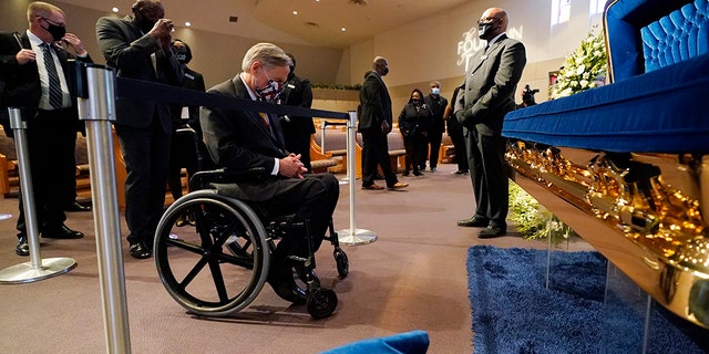 Texas Gov. Greg Abbott passes by the casket of George Floyd during a public visitation for Floyd at the Fountain of Praise church, Monday, June 8, 2020, in Houston. (AP Photo/David J. Phillip, Pool)