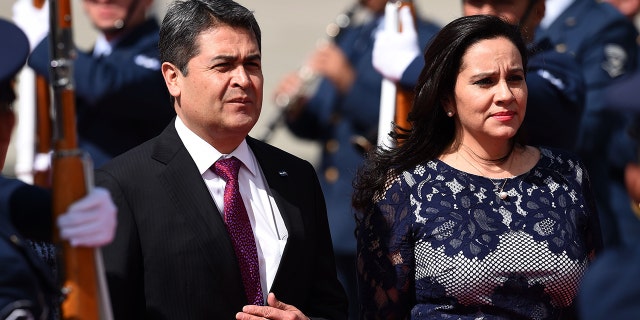 Honduran President Juan Orlando Hernandez (L) and his wife Ana Garcia have both tested for coronavirus. (Photo by Diana Sanchez / AFP) (Photo credit should read DIANA SANCHEZ/AFP via Getty Images)