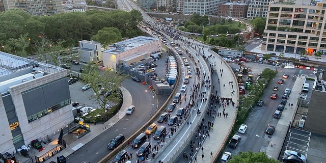 Hundreds of protestors streamed across the Brooklyn Bridge toward Manhattan on Monday night chanting "Whose streets? Our streets!"