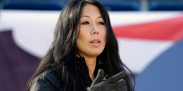 Kim Pegula stands on the field before the Buffalo Bills and New England Patriots game in Foxborough, Massachusetts, on Dec. 23, 2018.