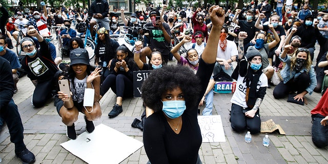 Demonstrators chant Tuesday, June 2, 2020, at Rittenhouse Square in Philadelphia, during a protest over the death of George Floyd, who died May 25 after he was restrained by Minneapolis police. 