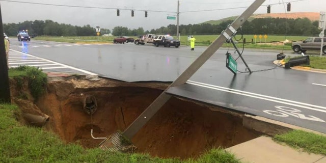 A sinkhole opened up along a roadway in Marion County, Florida, on Sunday, causing a crash.