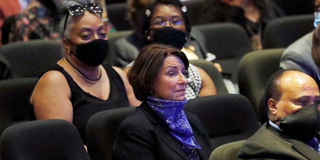 Sen. Amy Klobuchar, D-Minn., center sits among guests at North Central University Thursday, June 4, 2020, before a memorial service for George Floyd in Minneapolis. (AP Photo/Julio Cortez)