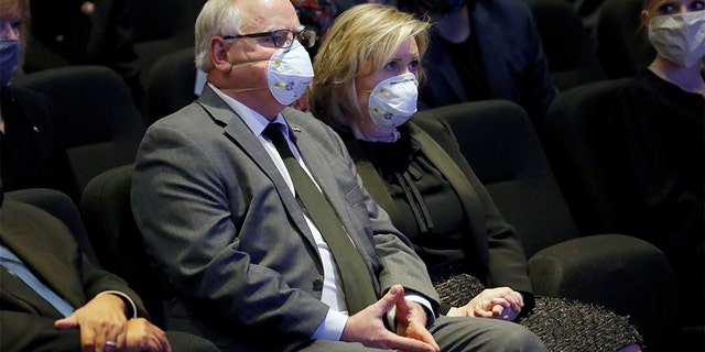 Minnesota Governor Tim Walz, center and his wife, Gwen Walz attend a memorial service for George Floyd at North Central University Thursday, June 4, 2020, in Minneapolis. (AP Photo/Julio Cortez)