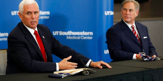 Vice President Mike Pence makes remarks as Texas Gov. Greg Abbott looks on during a news conference after Pence met with Abbott and members of his healthcare team regarding COVID-19. (AP Photo/Tony Gutierrez)