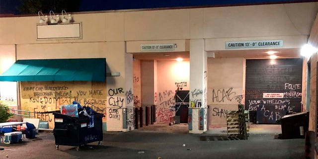 This Friday, June 26, 2020, photo released by the Portland Police Department shows damage after protests calling for an end to racial injustice and accountability for police in Portland, Ore. Some protesters set fire to a police precinct, vandalized businesses and tried to barricade police officers inside their station. (Portland Police Department via AP)