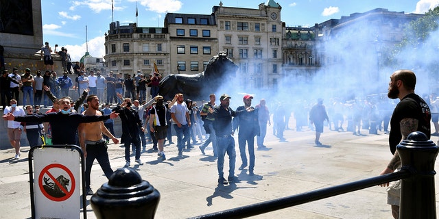 Counter-protesters gesture in Trafalgar Square ahead of a Black Lives Matter protest following the death of George Floyd in Minneapolis police custody, in London, Britain, June 13, 2020. 