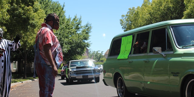 The social distance parade included cars and creepy clowns to celebrate with Brodie.