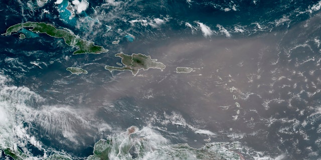This satellite photo provided by the National Oceanic and Atmospheric Administration, NOAA, shows a could of dust coming from the Sahara desert arriving to the Caribbean Monday, June 22, 2020.