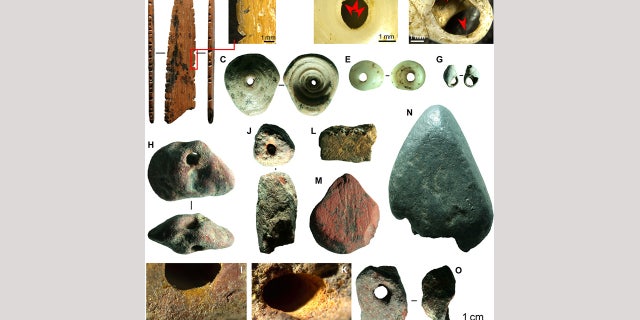 Fig. 4 Symbolic material culture of Fa-Hien Lena. (A and B) Possible decorated spatula, shuttle, or lissoir in bone; marine shell beads in (C to E) Conus spp. and (F and G) Nassariidae; ochre beads (H to K and O) and used (L) yellow, (M) red, and (N) mica colorants. (Science Advances)