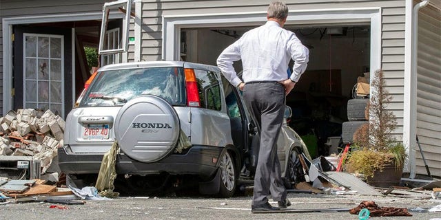 Massachusetts Gov. Charlie Baker tours the site where an 18-year-old man was killed during a gas explosion in Lawrence, Mass., Sept. 14, 2018. (AP Photo)