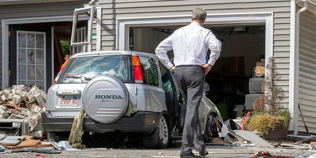 Massachusetts Gov. Charlie Baker tours the site where an 18-year-old man was killed during a gas explosion in Lawrence, Mass., Sept. 14, 2018. (AP Photo)