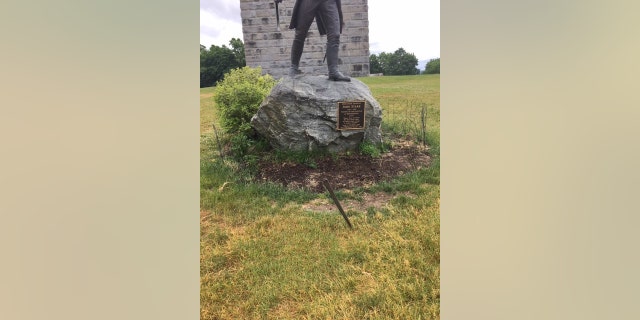 The sword was returned and discovered sticking in the ground near the statue.