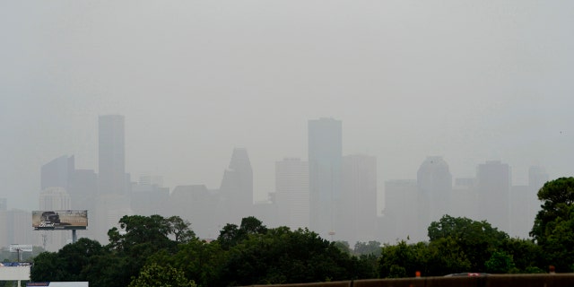 Downtown Houston is shown as a Saharan Dust cloud moves over parts of Texas, June 26, in Houston.