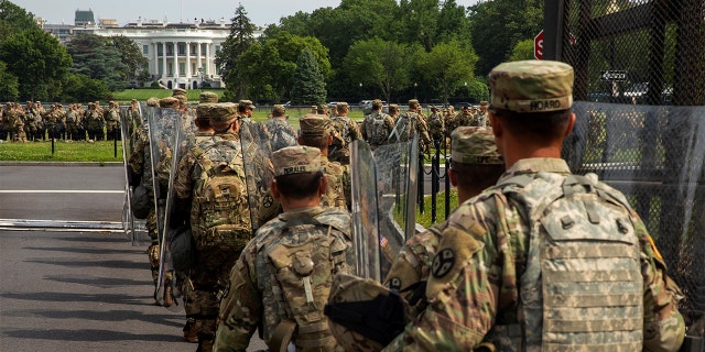 Uniformed military personnel walks into the secured White House area ahead of a protest against racial inequality in reaction to the death in Minneapolis police custody of George Floyd, in Washington, U.S., June 6, 2020. 