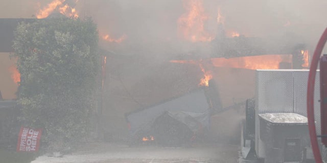 Several homes were destroyed after a wildfire erupted Wednesday in a California neighborhood.