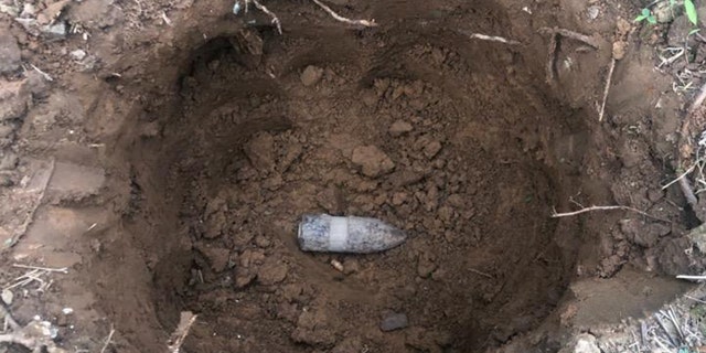 Kelly and Shannon Thomas were working on their flower bed when they uncovered a live World War I bomb.
